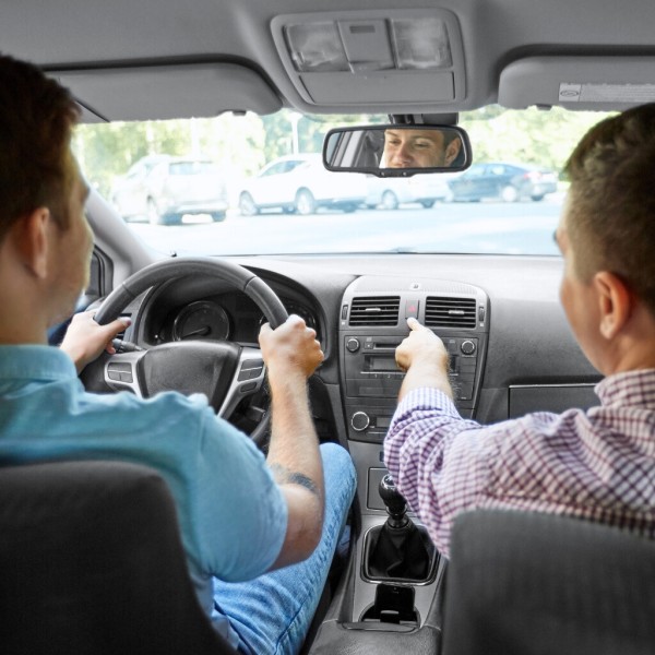 two people traveling in a car