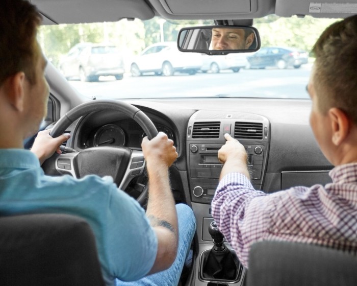 two people traveling in a car