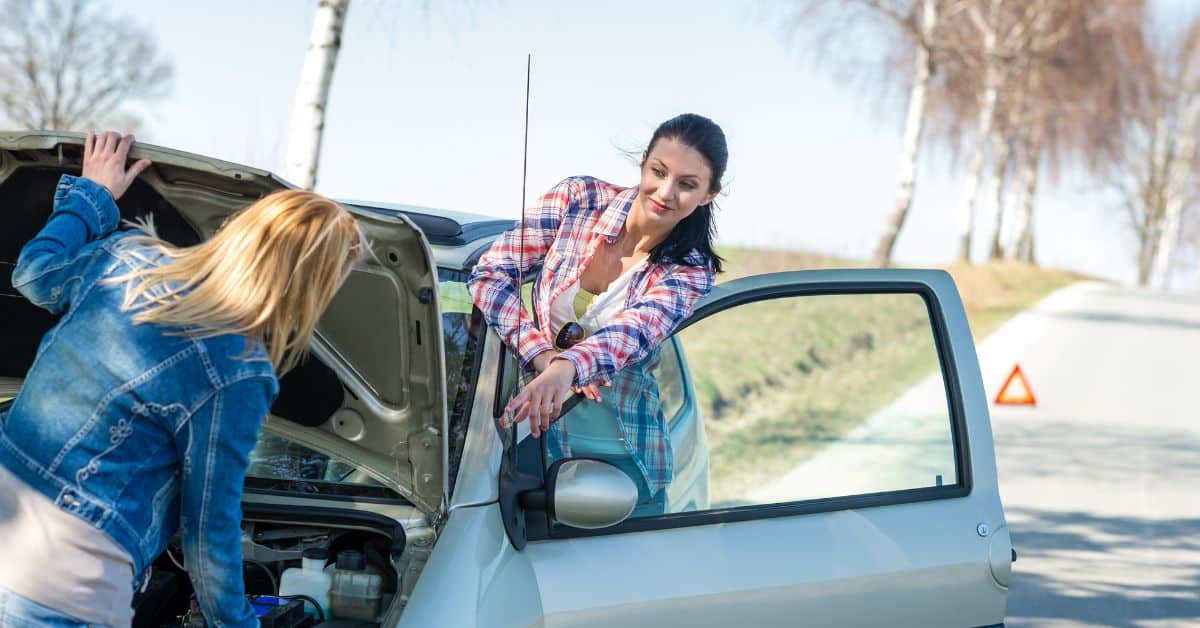 girl getting her car repaired